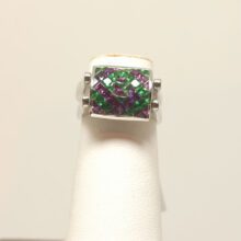 Koru” Emerald and Purple Sapphire 18K White Gold Reversible Ring Koru” Emerald and Purple Sapphire 18K White Gold Reversible Ring