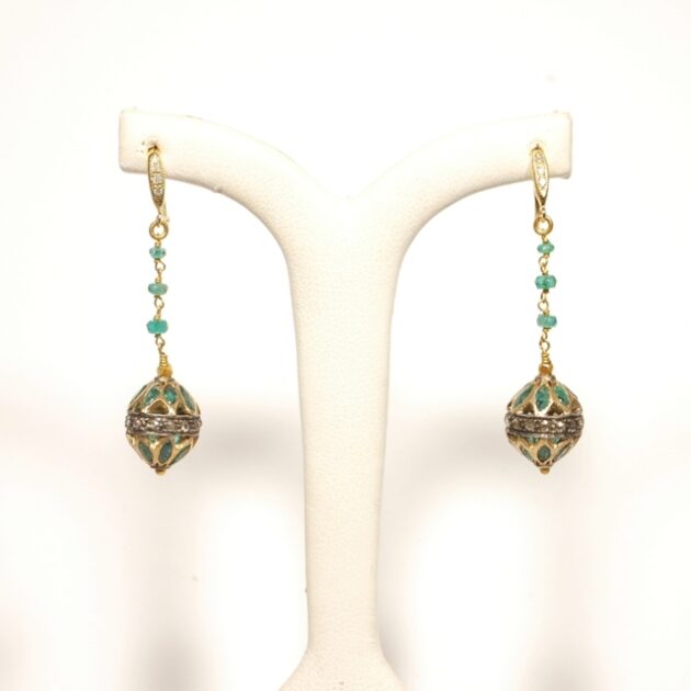 Emerald earrings studded with diamonds.