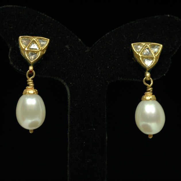 Pearl and diamond earrings.