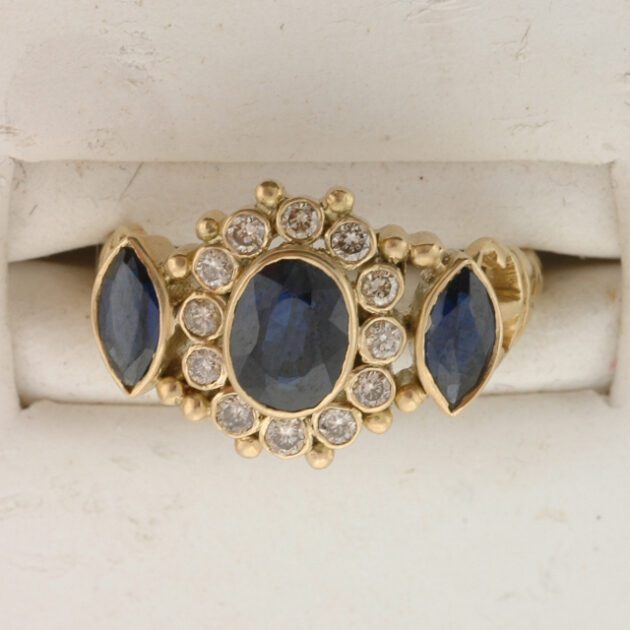 Sapphire ring studded with diamonds.