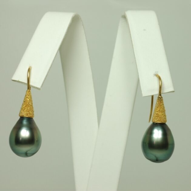 Tahitian black pearl earrings set in 22Kt gold.