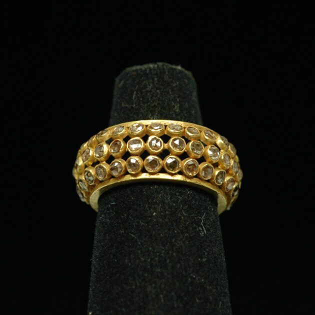 22Kt gold ring studded with diamonds.