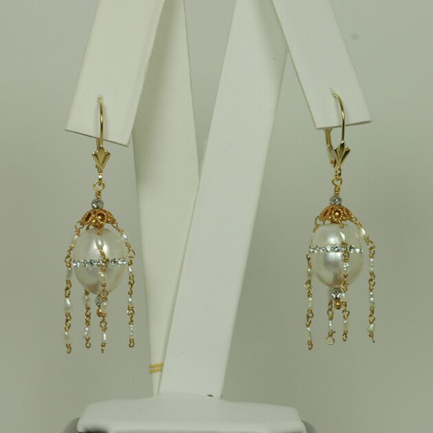 Pearl earrings studded with crystals.