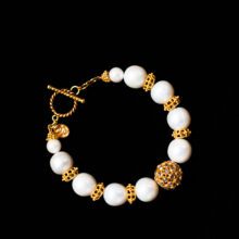 Luxury pearl and diamond bracelet with handcrafted 22K gold beads.