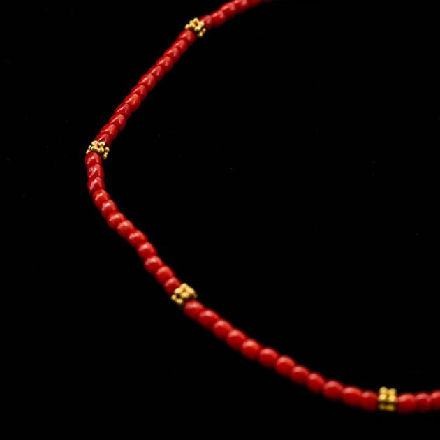 Designer necklace featuring natural red Mediterranean coral and 18K gold.