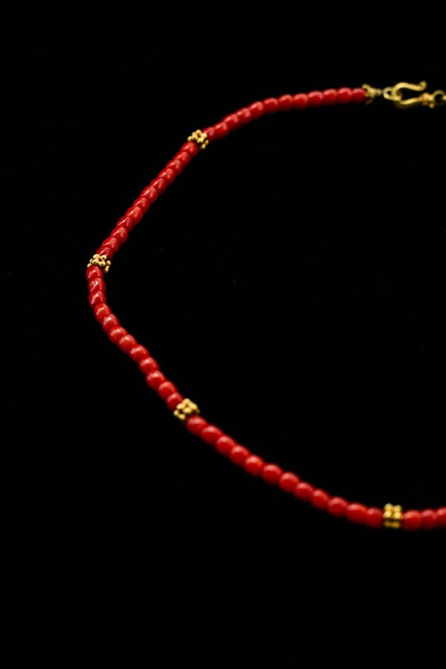 Designer necklace featuring natural red Mediterranean coral and 18K gold.