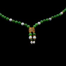 Designer jade bead necklace with 18K yellow gold details – modern statement piece.