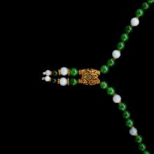 Luxury jade lariat necklace accented with polished 18K yellow gold links.