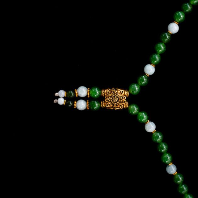 Luxury jade lariat necklace accented with polished 18K yellow gold links.