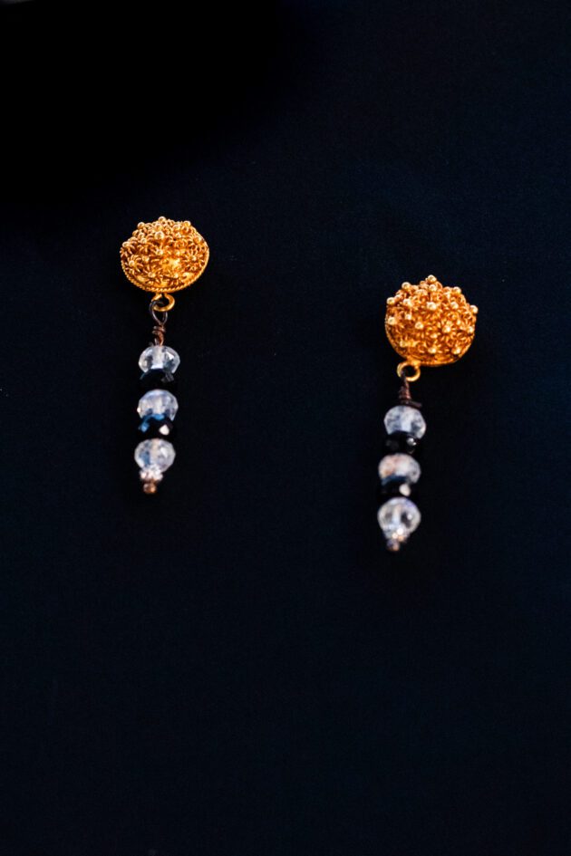 Luxury 22K gold granule earrings with moonstone and black diamond accents.