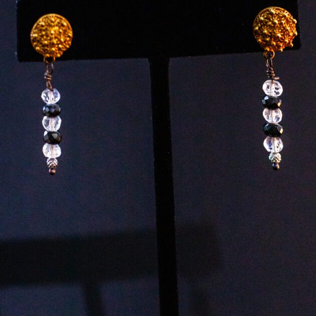 Designer fine jewelry – 22K gold earrings with moonstone and black diamond details.