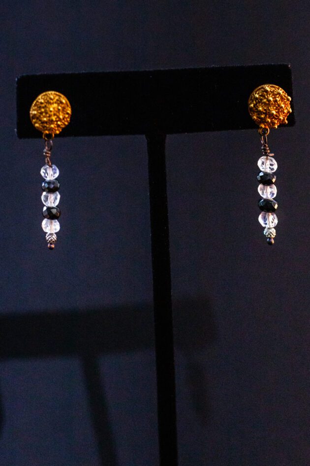 Designer fine jewelry – 22K gold earrings with moonstone and black diamond details.