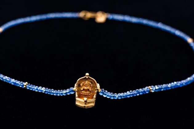 Lakshmi oil lamp on Blue sapphire necklace