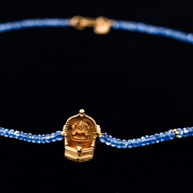 Lakshmi oil lamp on Blue sapphire necklace